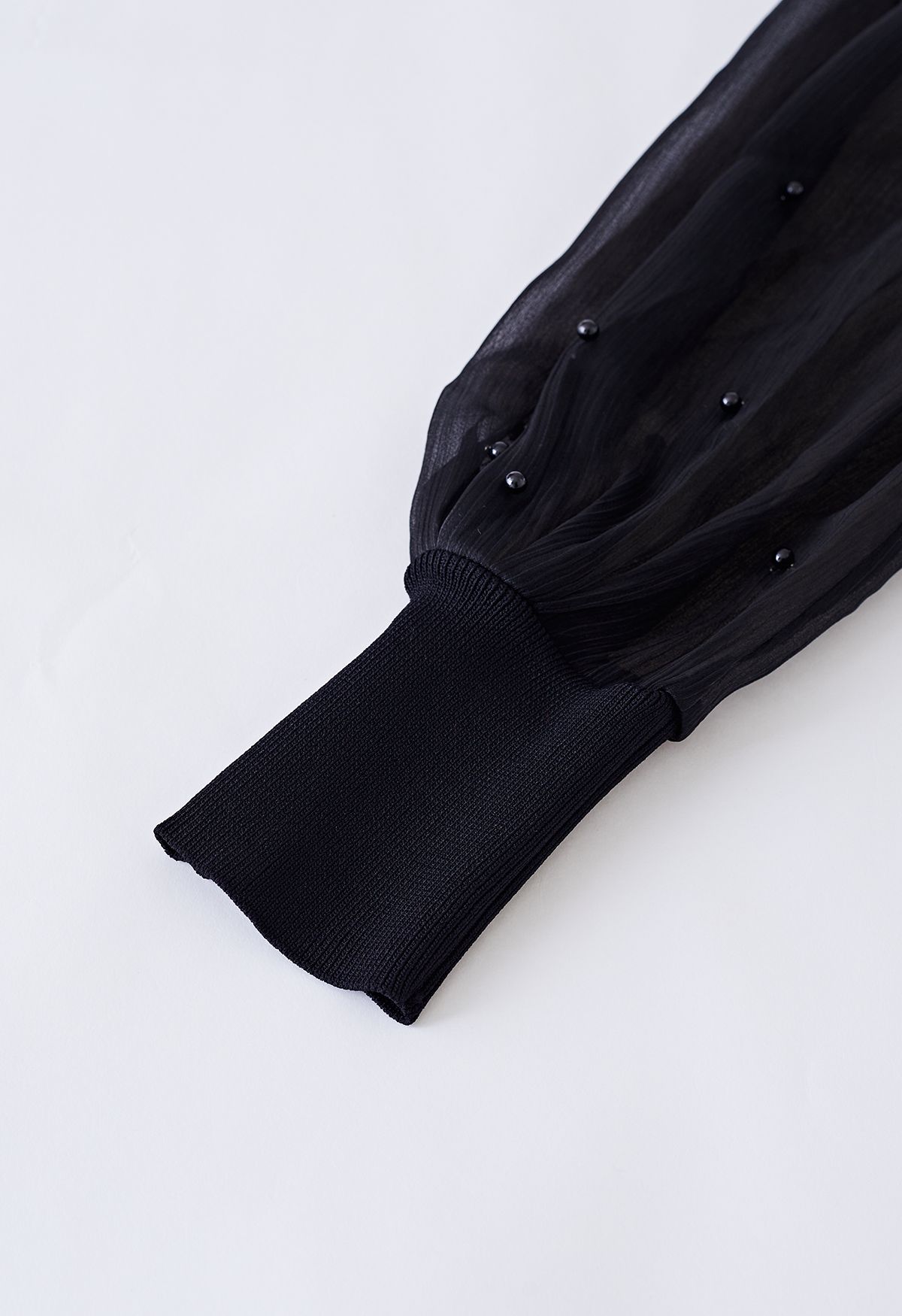 Pearl Puff Sleeve Spliced Faux-Wrap Top in Black