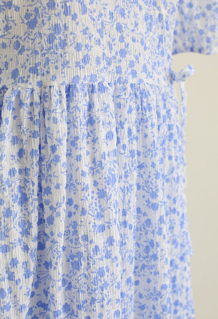 Enthralling Floret Embossed Wrap Midi Dress in Blue