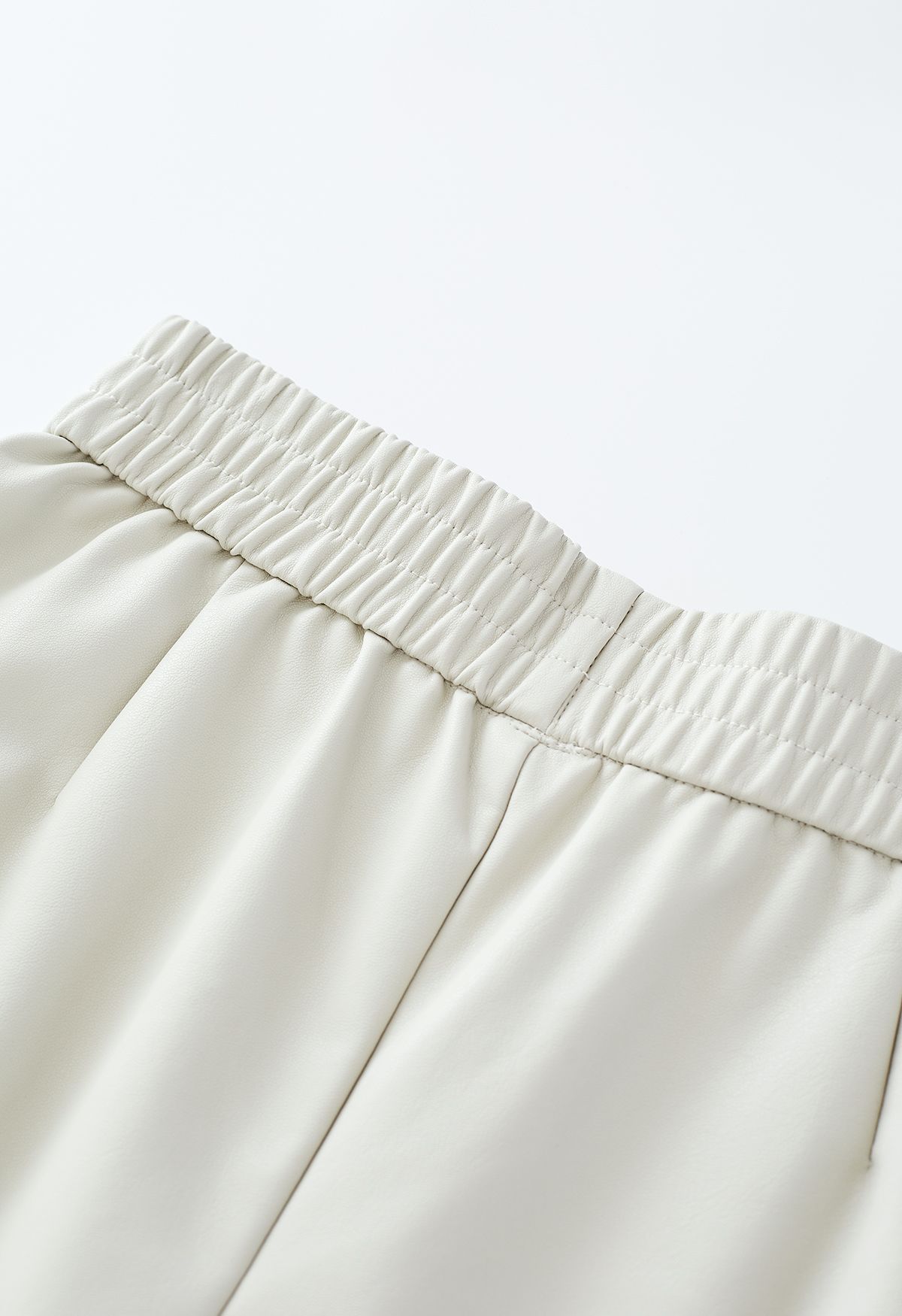 Textured Buttoned Faux Leather Shorts in Ivory