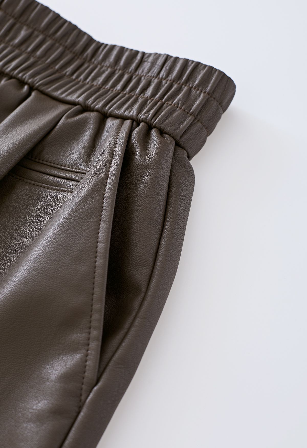 Textured Buttoned Faux Leather Shorts in Brown