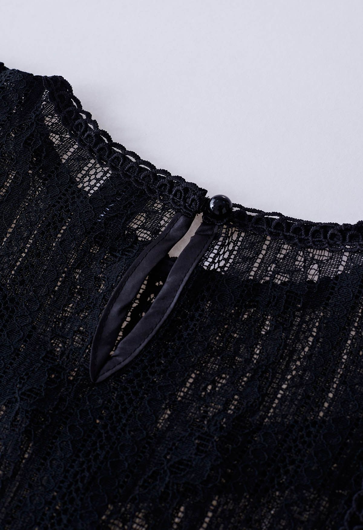 Sheer Sleeve Spliced Cutwork Lace Top in Black