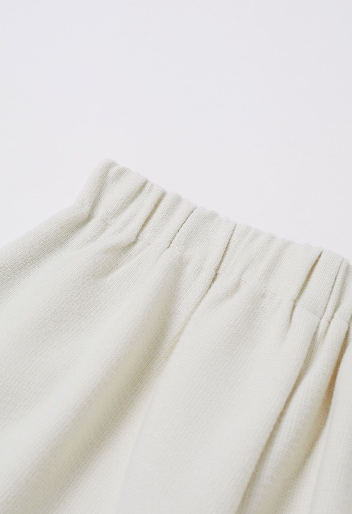 Side Pockets Pleats Wide-Legs Pants in Ivory