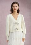 Sparkling Bowknot Buttoned Lantern Sleeve Knit Cardigan in Cream